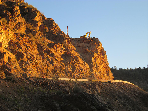 Sunrise with drill and track hoe