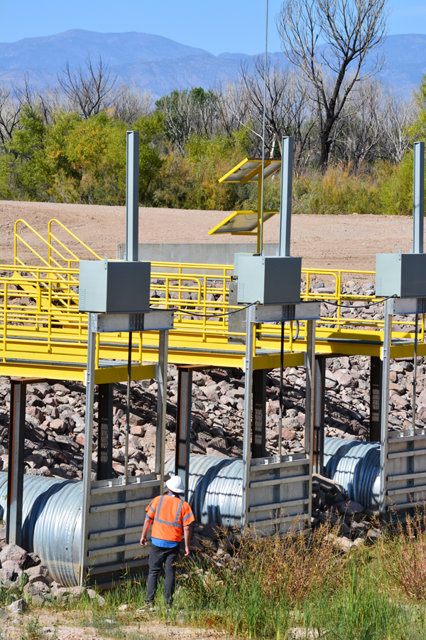 Bryan Lawlis, AAO Project Management Specialist, inspects the RM60 outfall gates