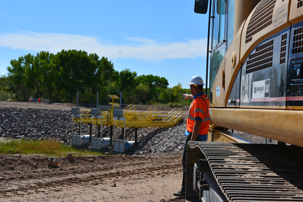Bryan Lawlis, AAO Project Management Specialist, looks over the RM60 outfall culverts