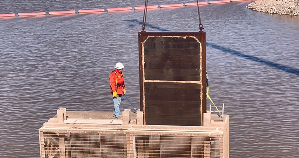 Stop log gate being lifted by crane