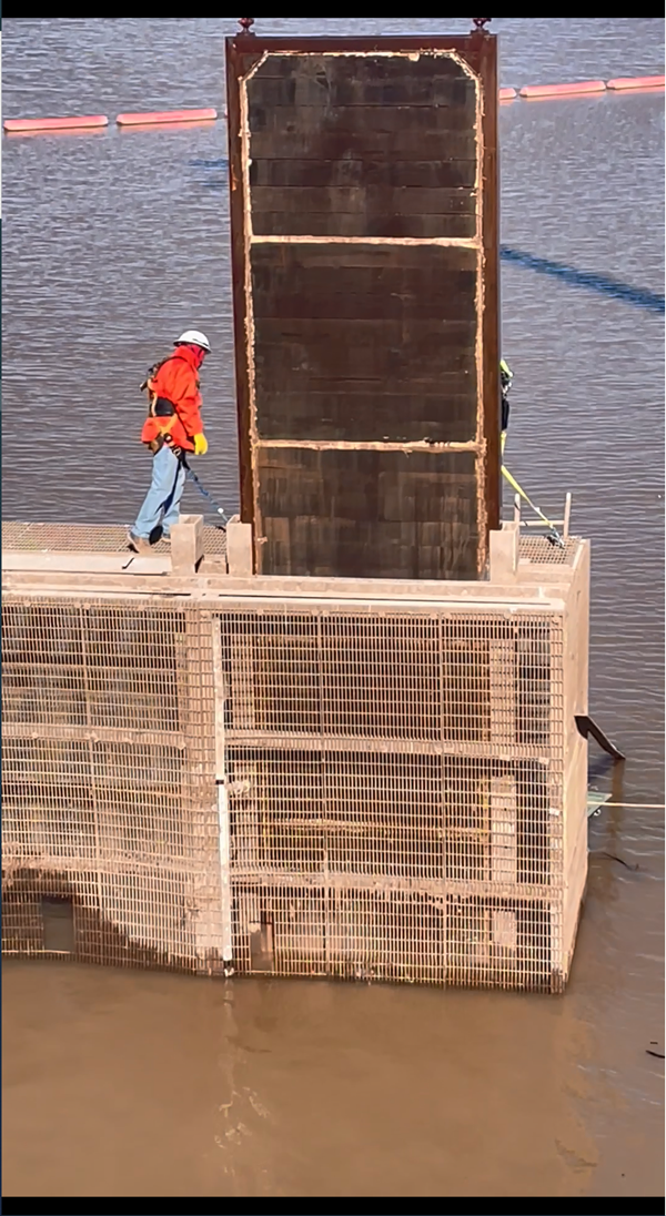 Stop log gate being lifted by crane