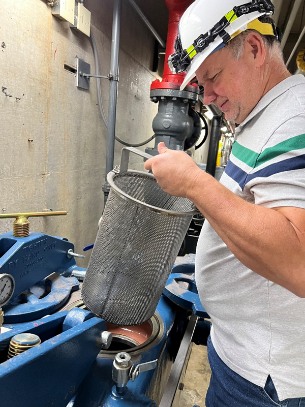 Glen Canyon mechanical engineer Ron Elder, shows off the new UV light and strainer system